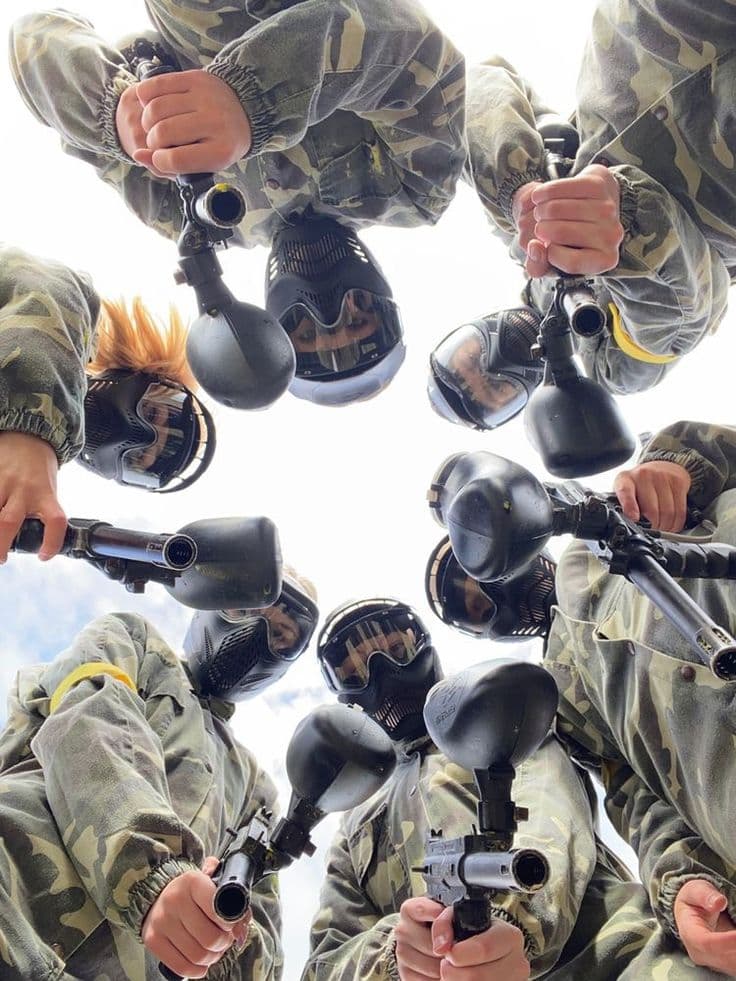 A group in paintball masks posing together